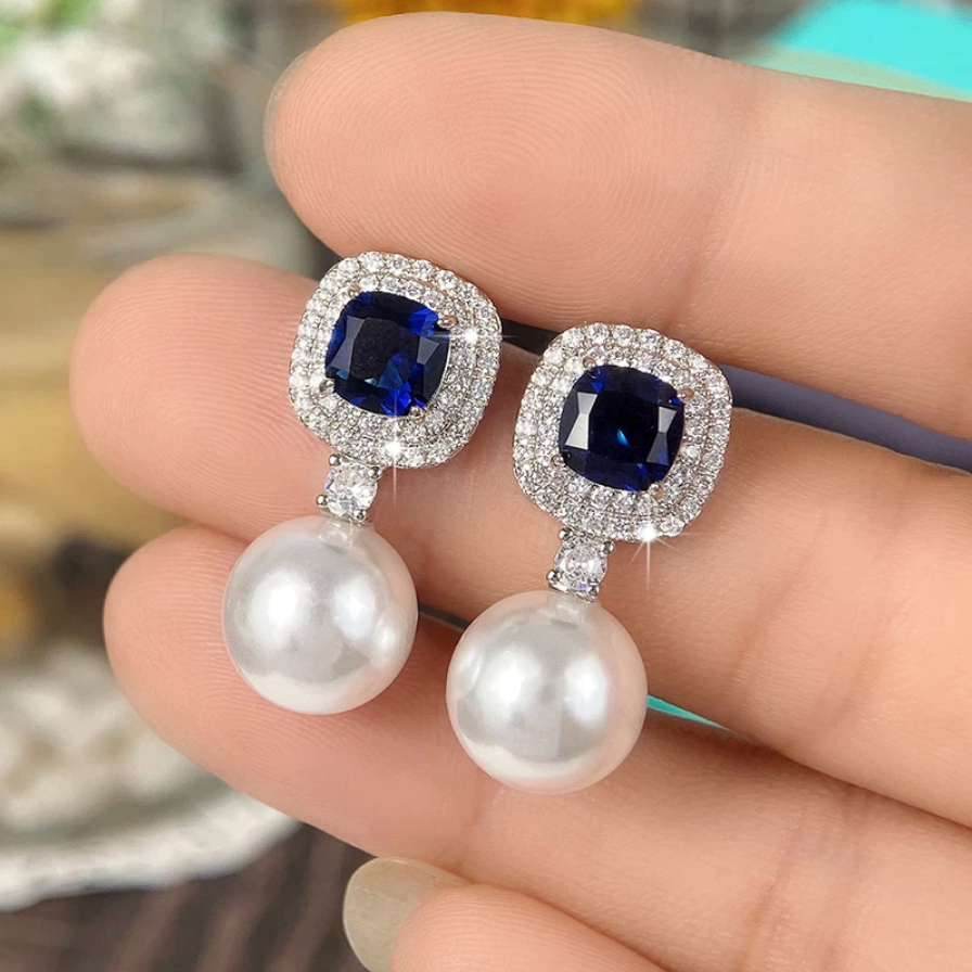 Earrings with shiny cubic blue zirconia and pearls