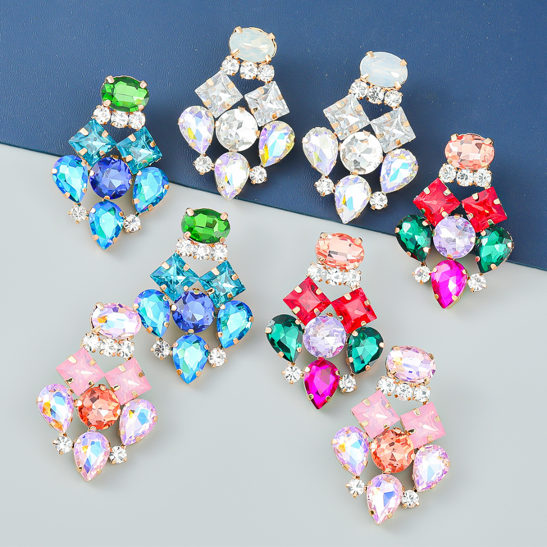 Symmetrically arranged earrings with large coloured zirconia gemstones